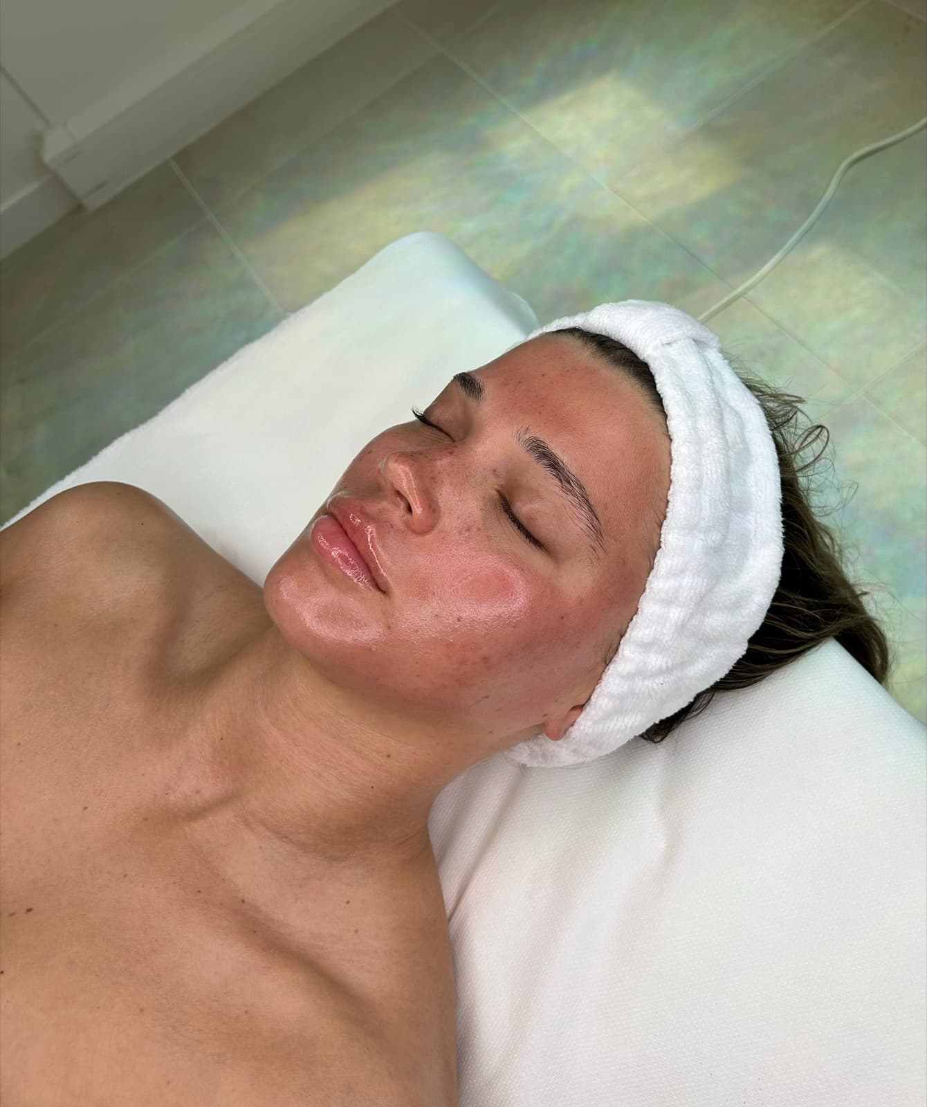 A client relaxing during a professional skincare treatment